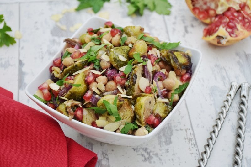 brussels sprouts, chickpeas & pomegranate chipotle salad with tahini maple dressing [vegan]