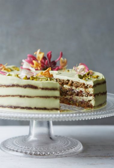 Courgette (zucchini), basil, lime and pistachio cake with avocado lime cream and raspberry jam (jelly) from Clean Cakes by Henrietta Inman, photography by Lisa Linder. Published by Jacqui Small