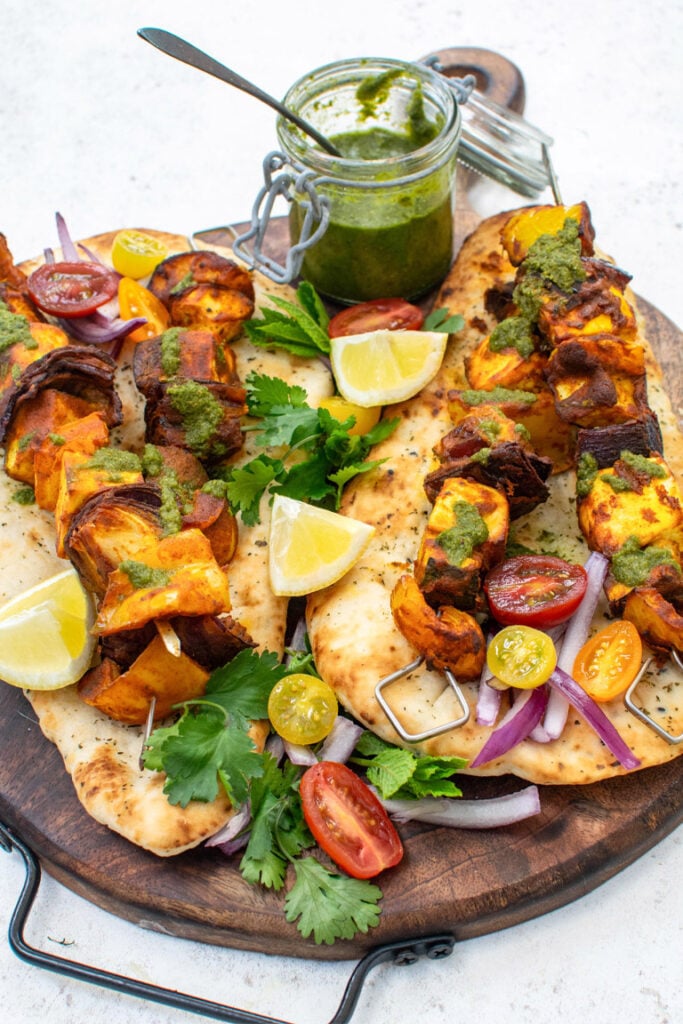 Paneer Kebabs on wooden board with coriander chutney