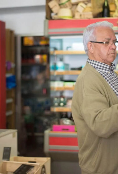 Photo by Kampus Production: https://www.pexels.com/photo/man-in-brown-cardigan-holding-a-box-8422699/