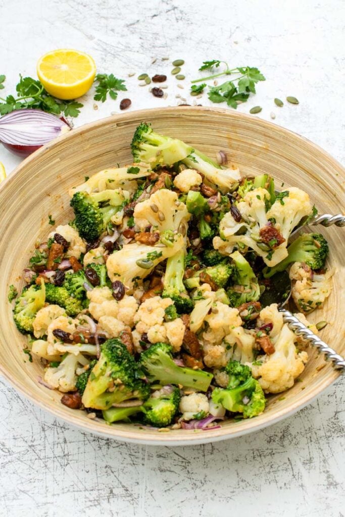 salad with with serving spoons
