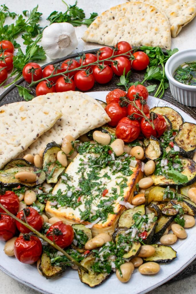 Close-up of creamy baked feta with butter beans and tomatoes