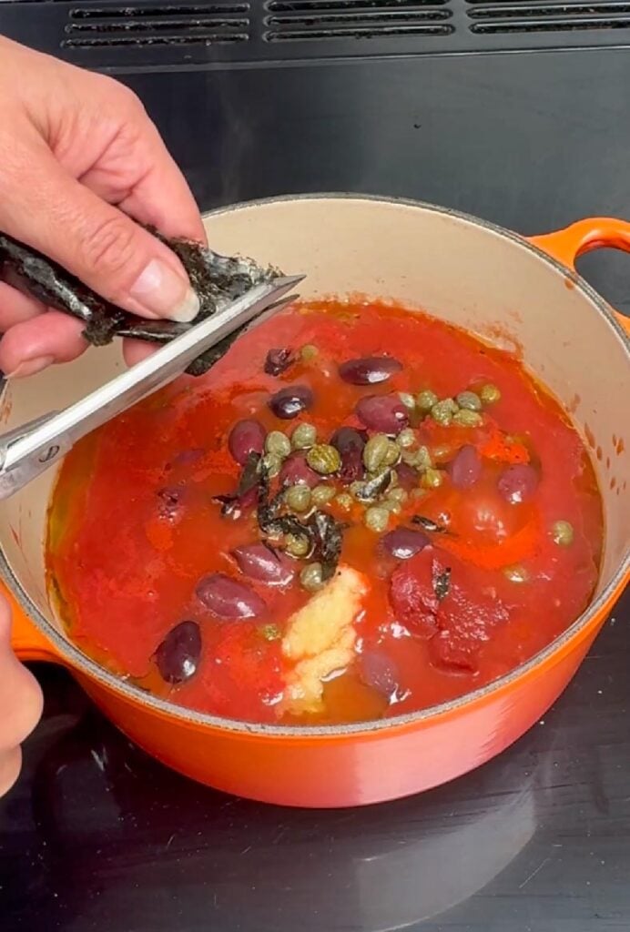 Nori flakes added to vegan puttanesca sauce for umami flavour