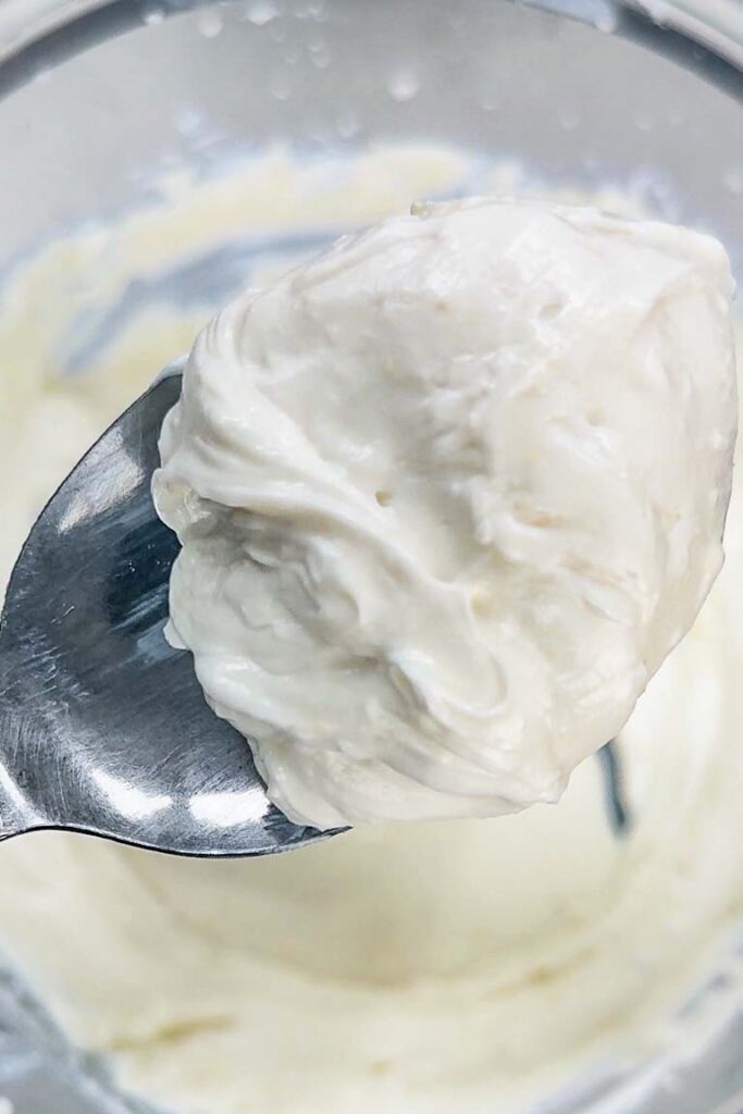 A spoonful of smooth, creamy whipped ricotta cheese