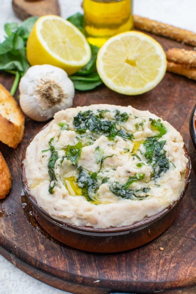 Cannellini dip served with croutons on a board