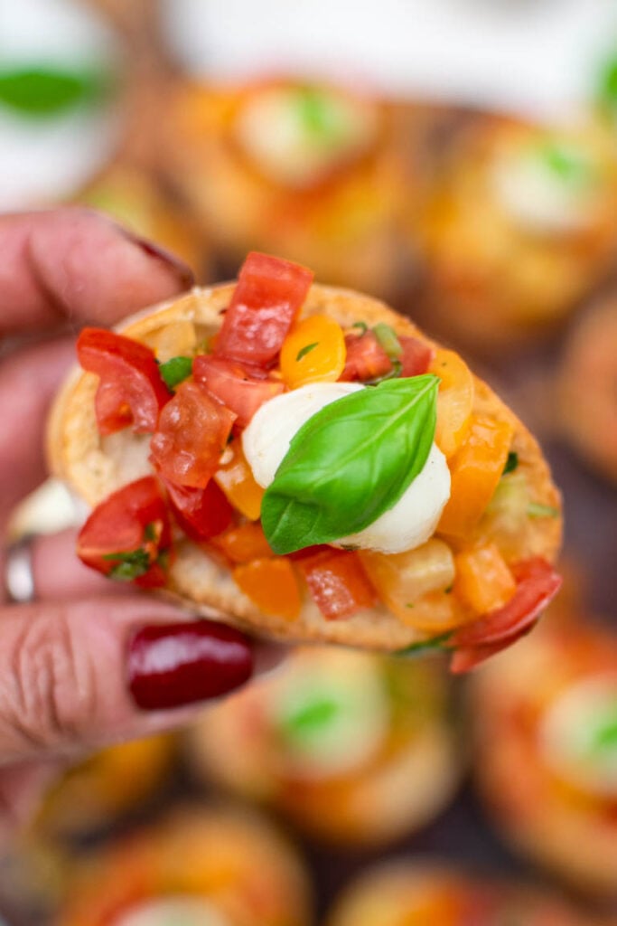 Close-up of Caprese Bruschetta with marinated cherry tomatoes and mozzarella