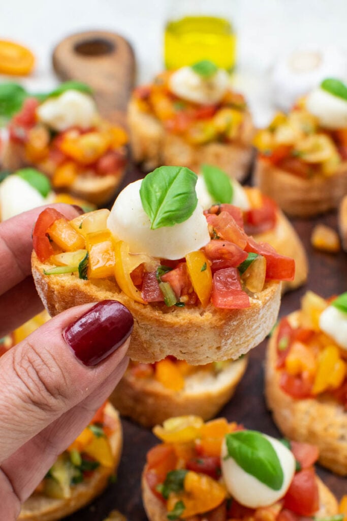 Mixed cherry tomatoes, basil and extra virgin olive oil for Caprese Bruschetta