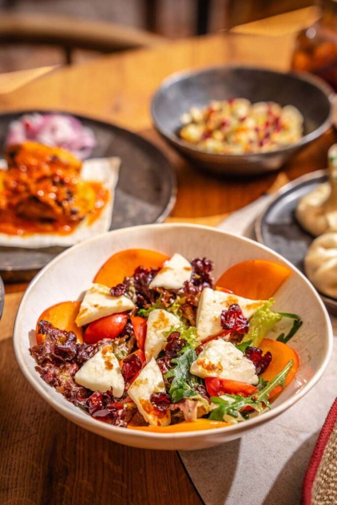 Colourful Mediterranean summer bowls with grilled vegetables, feta and fresh herbs