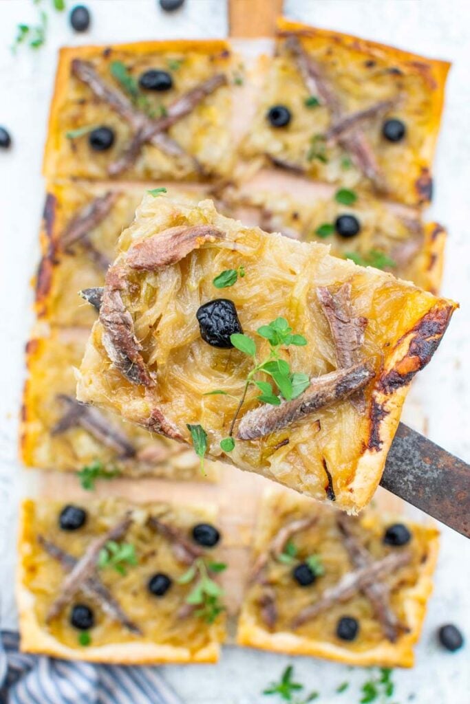 Pissaladière cut into squares, ready to serve