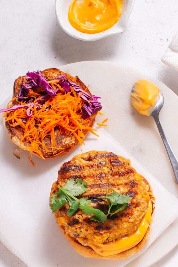 vegan chickpea burger on bun with garnish