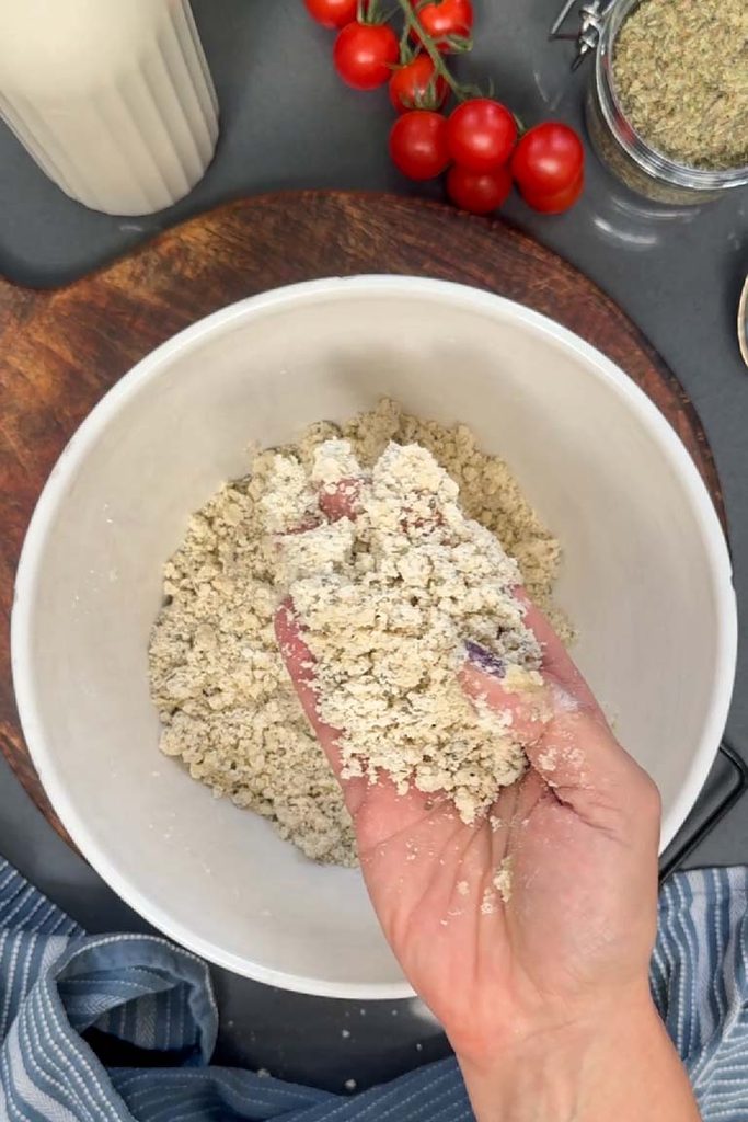 rubbing olive oil into flour to make pastry