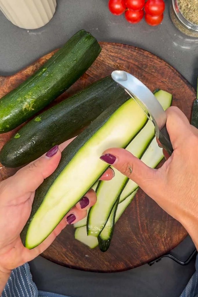 cutting courgette ribbons with vegetable peeler