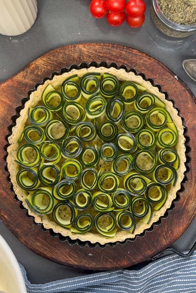 courgette feta quiche being assembled