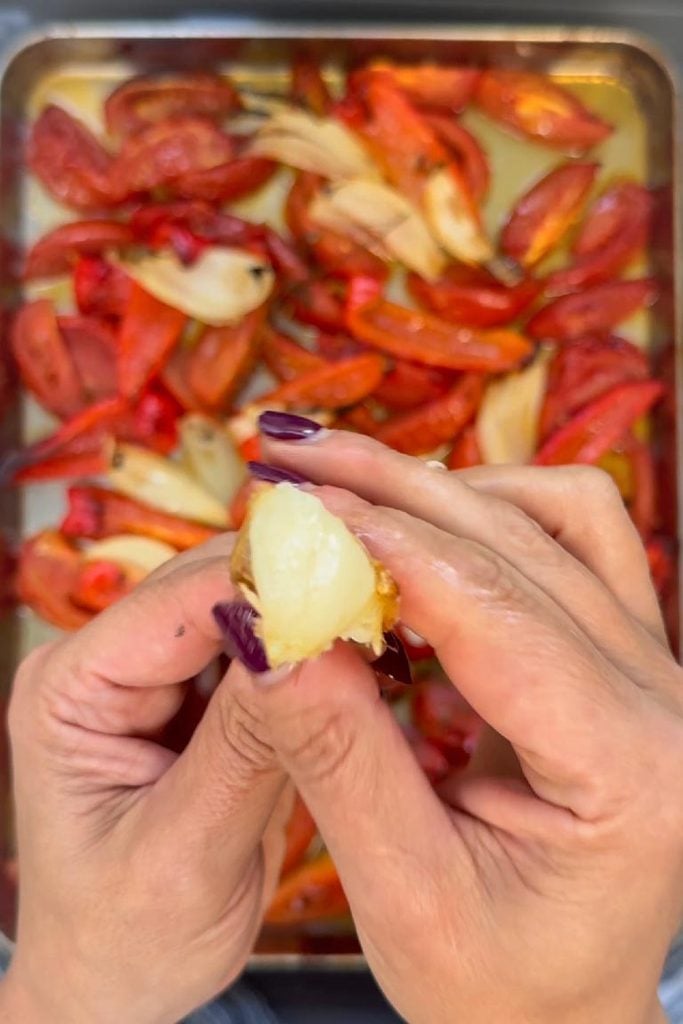 squeezing roased garlic out