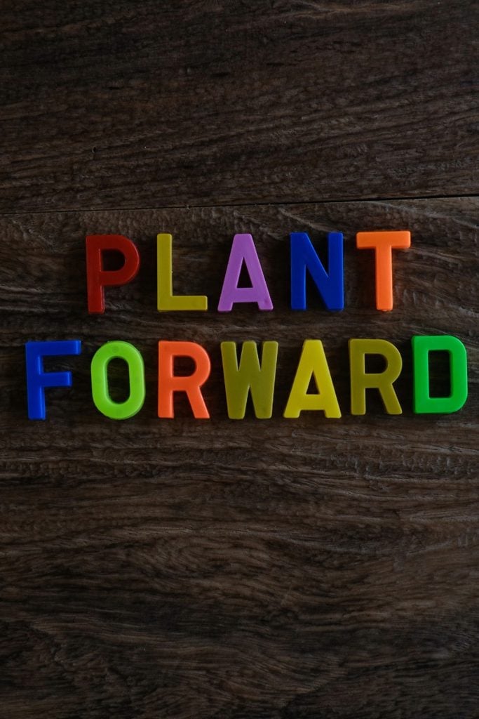 plant forward spelt out on wooden background