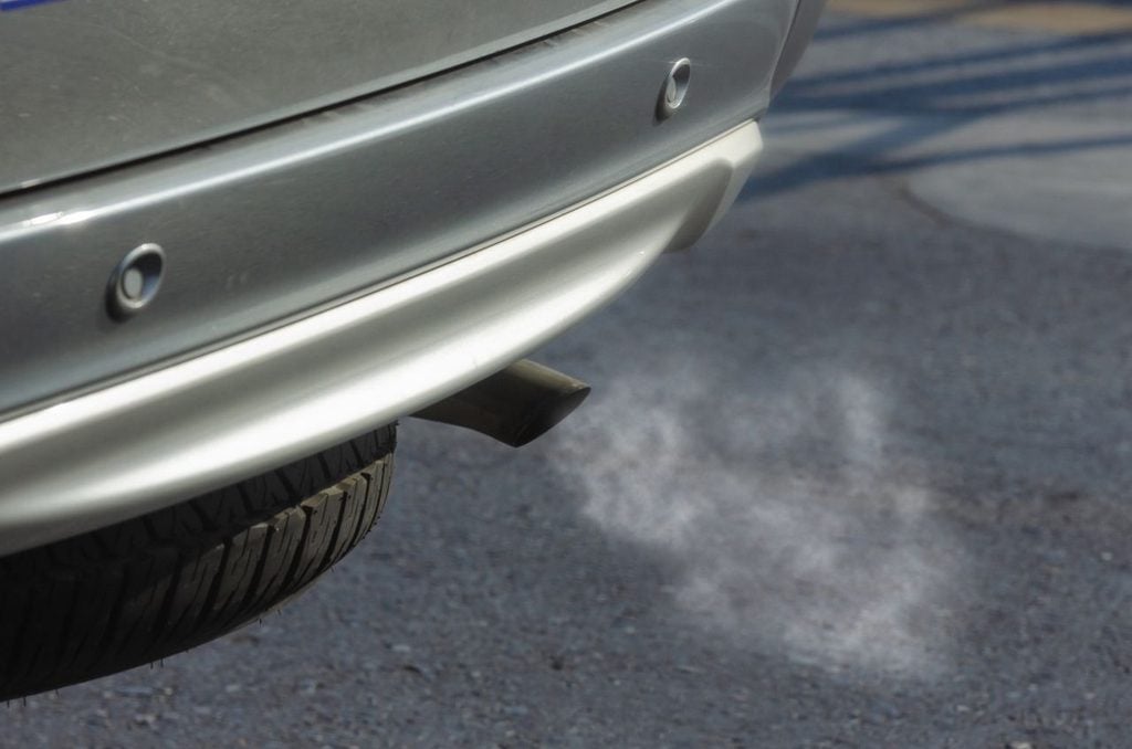 Older petrol car with clear exhaust smoke