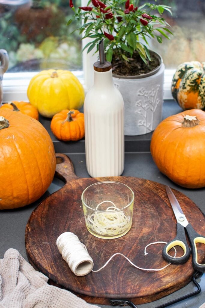 Close-up of pumpkin shaped bread with deep twine-marked segments and a pumpkin stalk on top