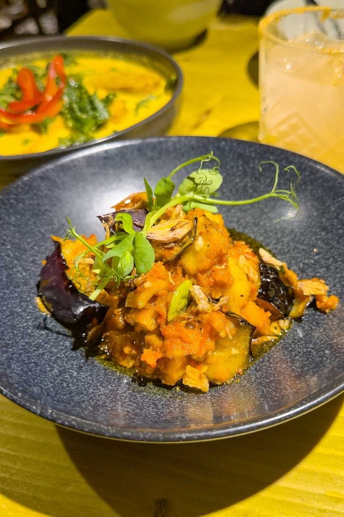 Terong Balado, aubergine stir-fried with tofu and petai beans in chilli sauce