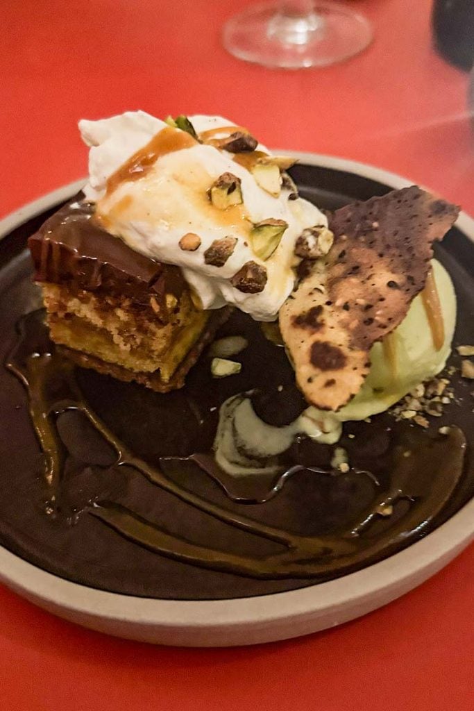 Dark chocolate, delicata squash and caramelised pistachio layered cake  and Pandan and candied ginger ice cream 